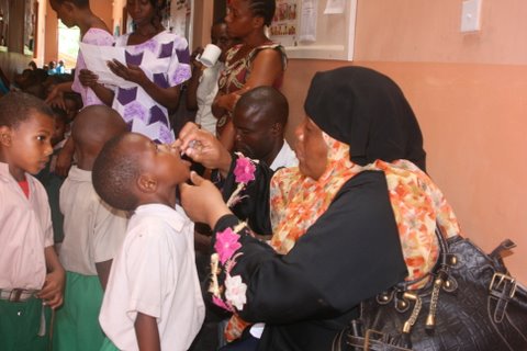 Nurse providing polio vaccination
