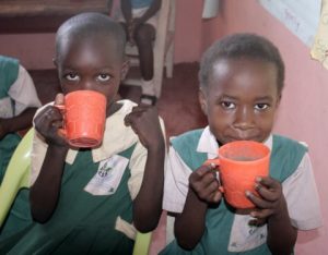 Children drinking porridge